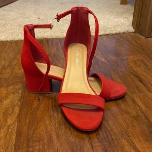 Red open toed heels. Worn maybe twice. Size 6 1/2 by the brand “Cityclassified”